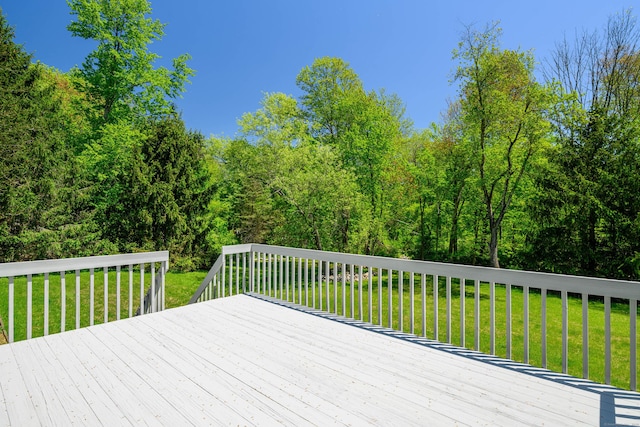 deck featuring a lawn