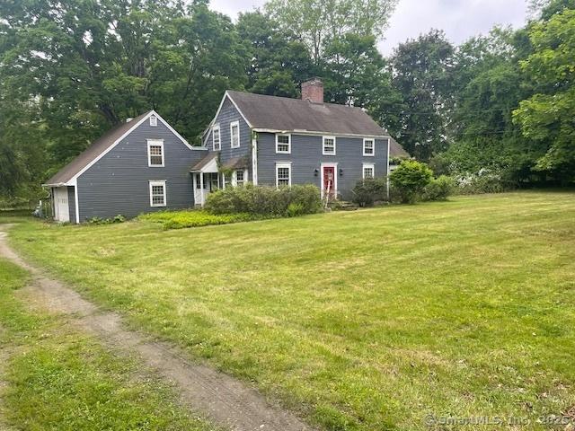 110 Cross Hwy, Westport, CT 06880 - colonial-style house with a chimney and a front yard