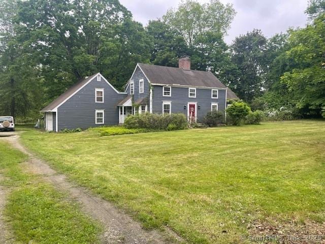 110 Cross Hwy, Westport, CT 06880 - view of front facade featuring a chimney and a front lawn