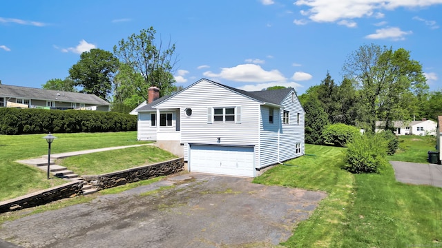 192 Morgan Cir, Wethersfield, CT 06109 - view of side of property featuring driveway, a garage, a yard, and a chimney