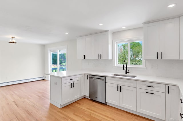 192 Morgan Cir, Wethersfield, CT 06109 - kitchen with a sink, dishwasher, a peninsula, tasteful backsplash, and recessed lighting