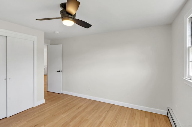 192 Morgan Cir, Wethersfield, CT 06109 - unfurnished bedroom with a baseboard heating unit, light wood-type flooring, baseboards, and a closet