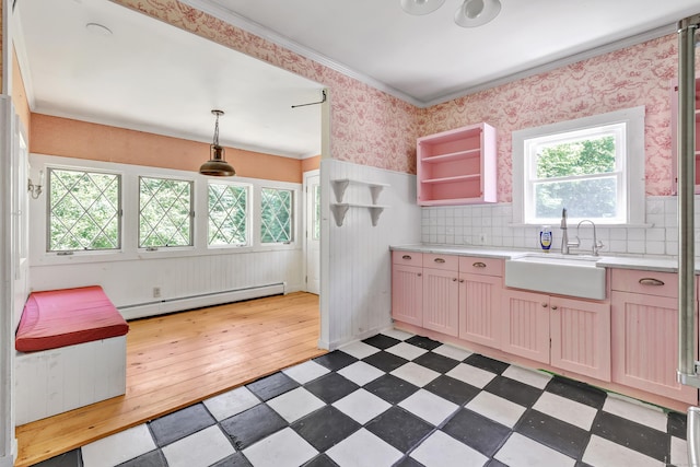 13 Hoyt Rd, Bethel, CT 06801 - kitchen featuring a baseboard heating unit, a sink, light countertops, wainscoting, and open shelves