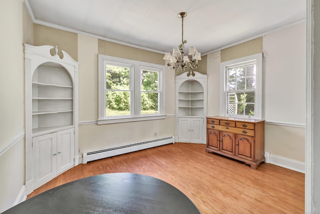 13 Hoyt Rd, Bethel, CT 06801 - dining area with a baseboard heating unit, a chandelier, light wood-style flooring, and crown molding