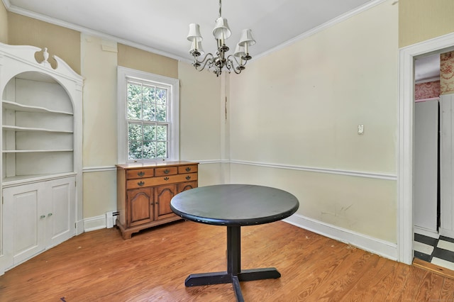 13 Hoyt Rd, Bethel, CT 06801 - dining room with a chandelier, light wood-style floors, crown molding, and baseboards
