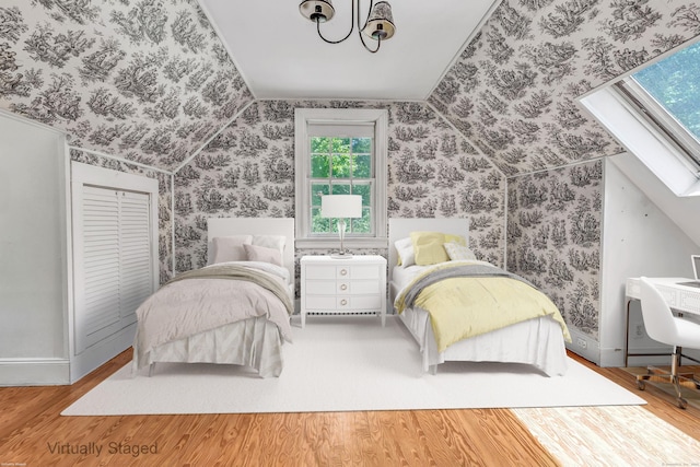 13 Hoyt Rd, Bethel, CT 06801 - bedroom featuring wood finished floors, vaulted ceiling, wallpapered walls, and baseboards