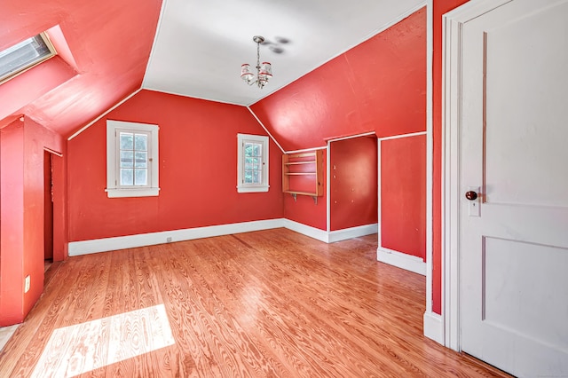 13 Hoyt Rd, Bethel, CT 06801 - additional living space with wood finished floors, plenty of natural light, vaulted ceiling, and baseboards