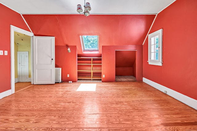 13 Hoyt Rd, Bethel, CT 06801 - bonus room featuring vaulted ceiling, wood finished floors, radiator heating unit, and a skylight