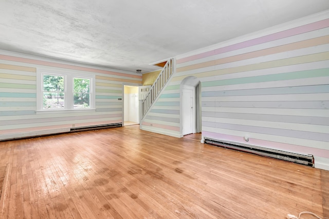 13 Hoyt Rd, Bethel, CT 06801 - unfurnished living room featuring hardwood / wood-style flooring, stairs, crown molding, and a baseboard radiator
