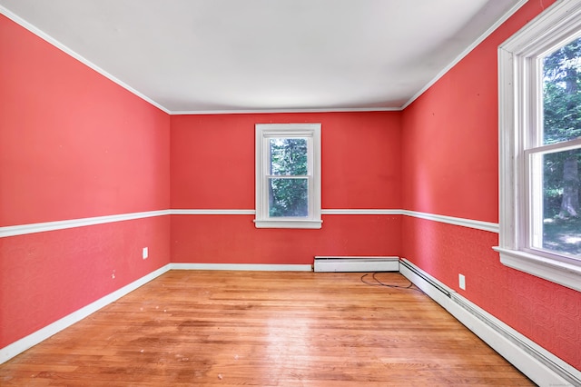 13 Hoyt Rd, Bethel, CT 06801 - spare room featuring wood finished floors, ornamental molding, baseboard heating, and baseboards