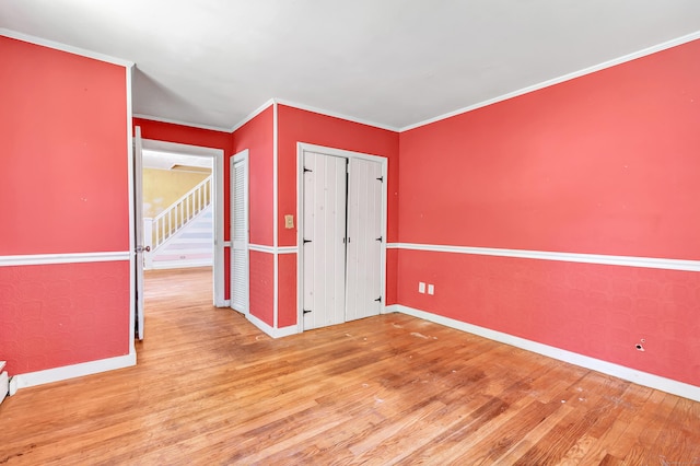 13 Hoyt Rd, Bethel, CT 06801 - unfurnished bedroom with baseboards, wood finished floors, ornamental molding, and a closet