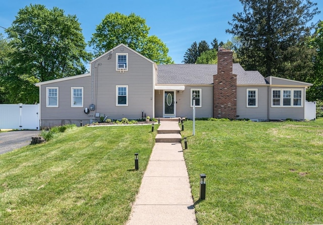 17 Emily Rd, East Windsor, CT 06016 - traditional-style house featuring a chimney and a gate