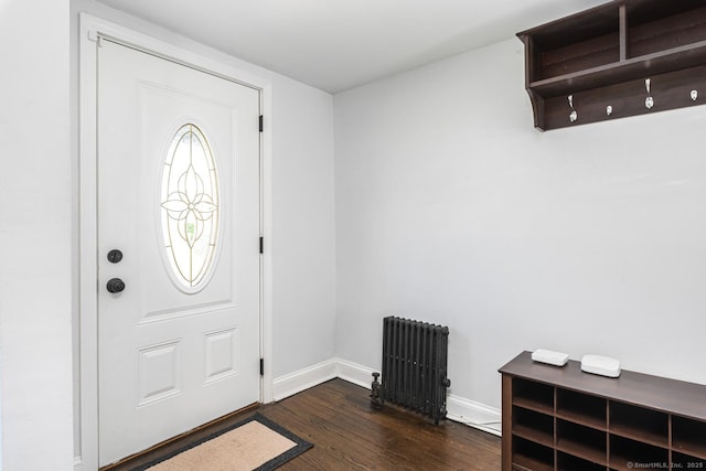 17 Emily Rd, East Windsor, CT 06016 - entrance foyer with radiator heating unit, dark wood-style floors, and baseboards