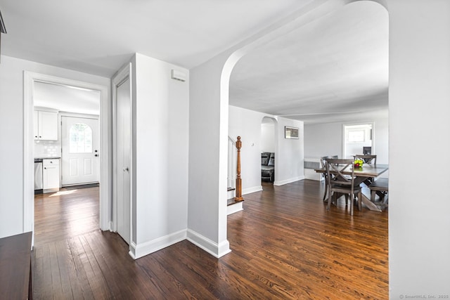 17 Emily Rd, East Windsor, CT 06016 - hallway with arched walkways, dark wood-style flooring, and baseboards
