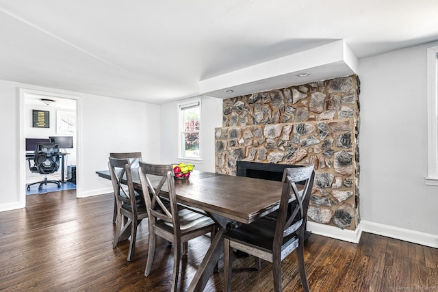 17 Emily Rd, East Windsor, CT 06016 - dining room featuring baseboards, wood finished floors, an office area, and a stone fireplace