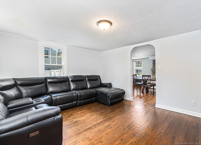 17 Emily Rd, East Windsor, CT 06016 - living room with arched walkways, wood finished floors, baseboards, a textured ceiling, and crown molding