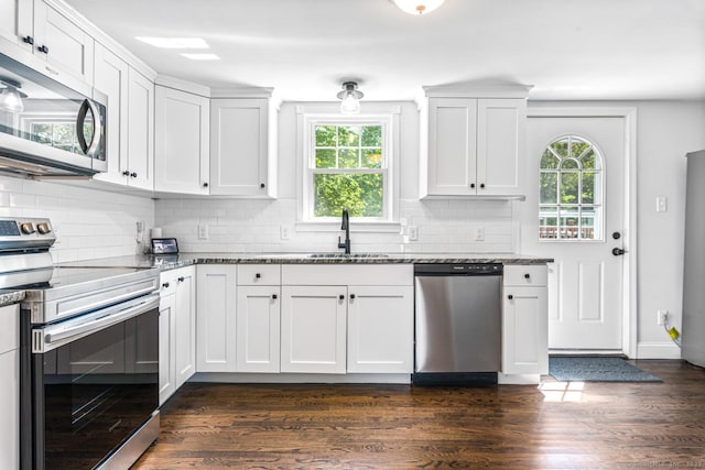 17 Emily Rd, East Windsor, CT 06016 - kitchen featuring stainless steel appliances, a sink, dark stone counters, and backsplash