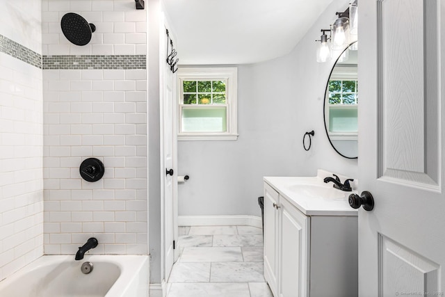 17 Emily Rd, East Windsor, CT 06016 - bathroom featuring marble look tiles, vanity, shower / bathtub combination, and baseboards