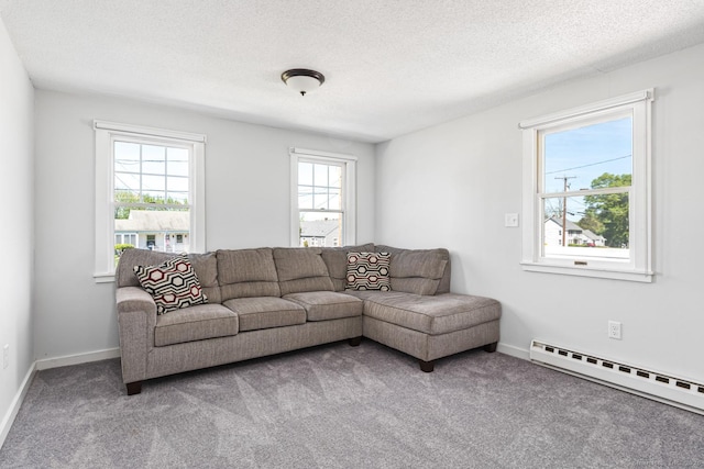 17 Emily Rd, East Windsor, CT 06016 - carpeted living room featuring a baseboard radiator, a textured ceiling, and baseboards