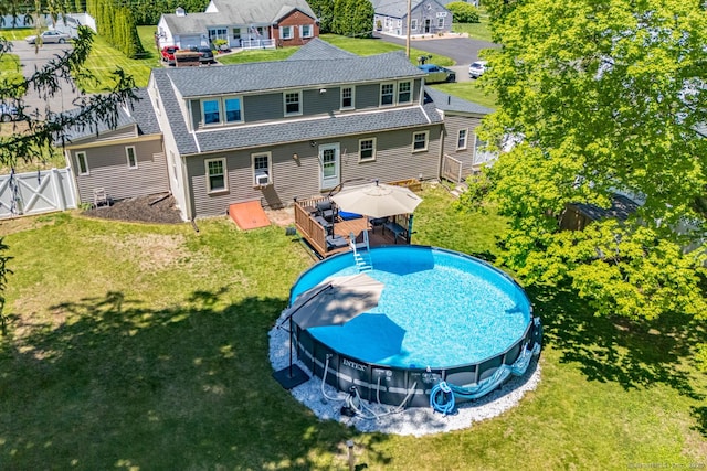 17 Emily Rd, East Windsor, CT 06016 - back of property with a wooden deck, a gate, and roof with shingles