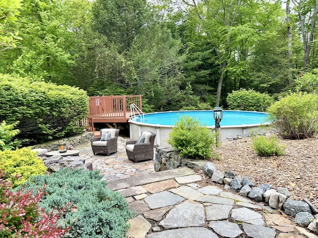 9 Pheasant Run, Granby, CT 06060 - outdoor pool featuring a patio area and a view of trees