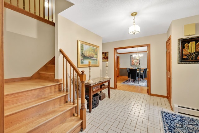 9 Pheasant Run, Granby, CT 06060 - foyer featuring baseboards, a chandelier, a baseboard heating unit, brick patterned flooring, and stairs