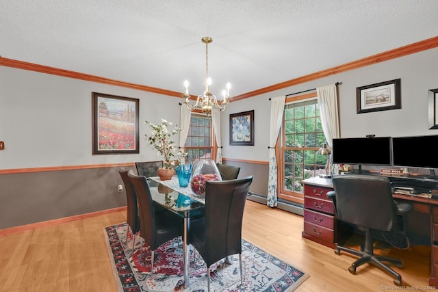 9 Pheasant Run, Granby, CT 06060 - dining space featuring a chandelier, ornamental molding, light wood-type flooring, a textured ceiling, and a baseboard heating unit