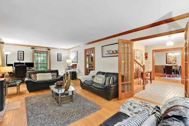 9 Pheasant Run, Granby, CT 06060 - living area with light wood-type flooring, ornamental molding, and french doors