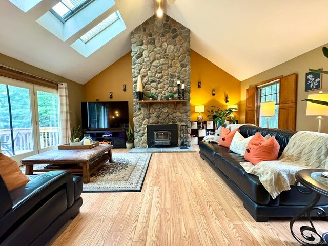 9 Pheasant Run, Granby, CT 06060 - living room featuring high vaulted ceiling, a skylight, and wood finished floors