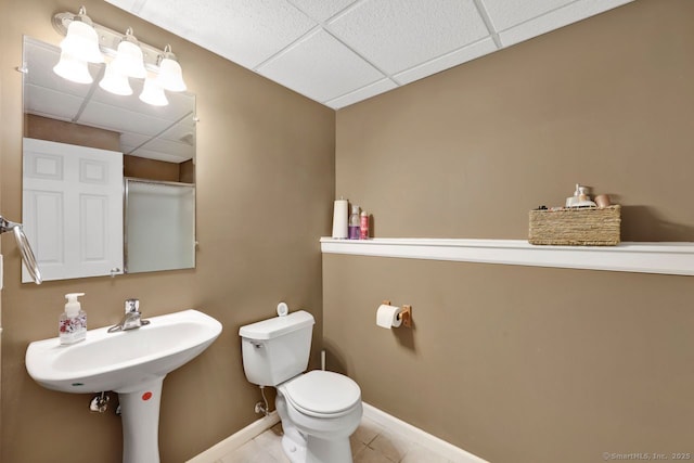 9 Pheasant Run, Granby, CT 06060 - bathroom with a drop ceiling, toilet, tile patterned flooring, and baseboards