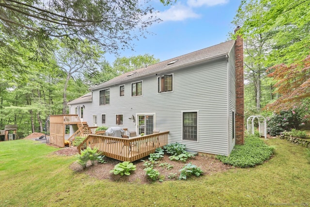 9 Pheasant Run, Granby, CT 06060 - back of house featuring a chimney, a deck, and a lawn