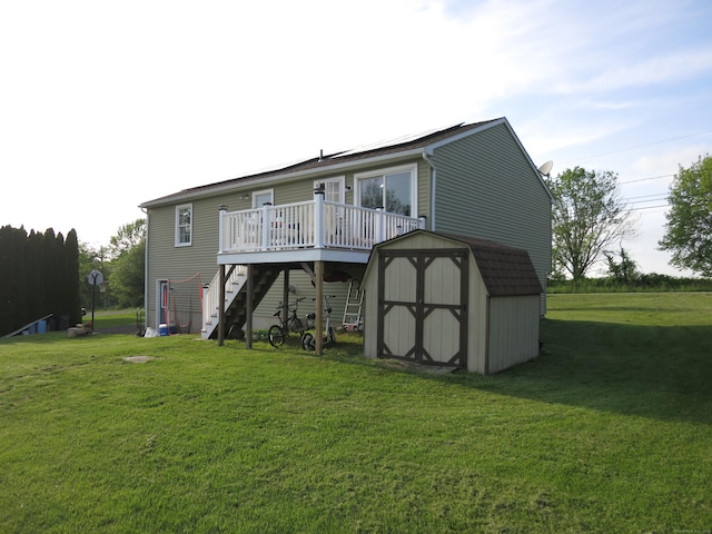 23 Hell Hollow Rd, Sterling, CT 06384 - rear view of house featuring a storage unit, a wooden deck, stairs, and a yard