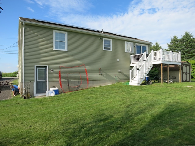 23 Hell Hollow Rd, Sterling, CT 06384 - rear view of house with stairway, a storage unit, a deck, and a lawn