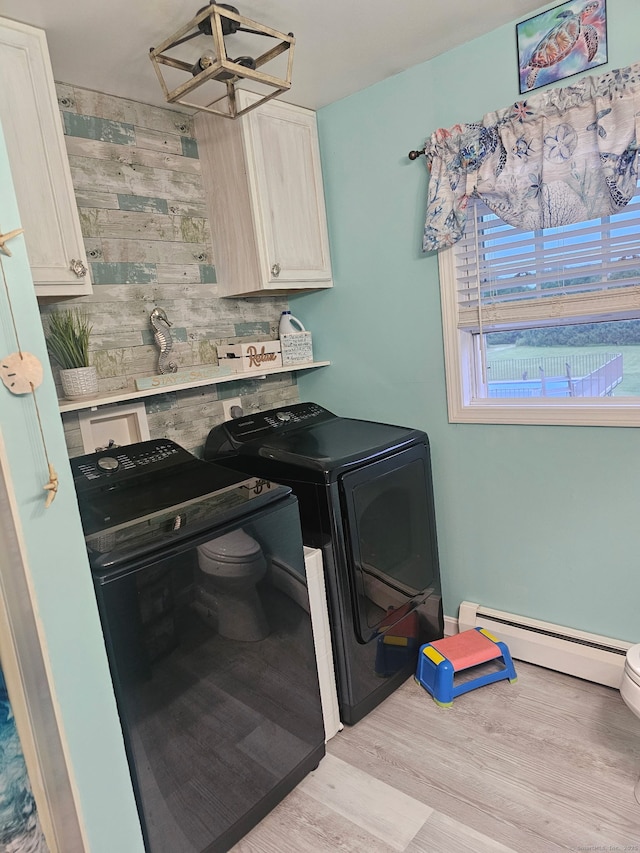 23 Hell Hollow Rd, Sterling, CT 06384 - washroom with baseboard heating, independent washer and dryer, a chandelier, light wood finished floors, and cabinet space