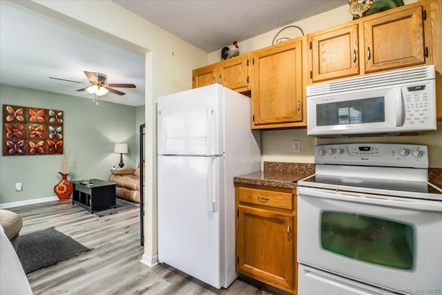 40 Glen Ridge Ct Unit 40, New Milford, CT 06776 - kitchen featuring white appliances, light wood-type flooring, ceiling fan, dark countertops, and baseboards