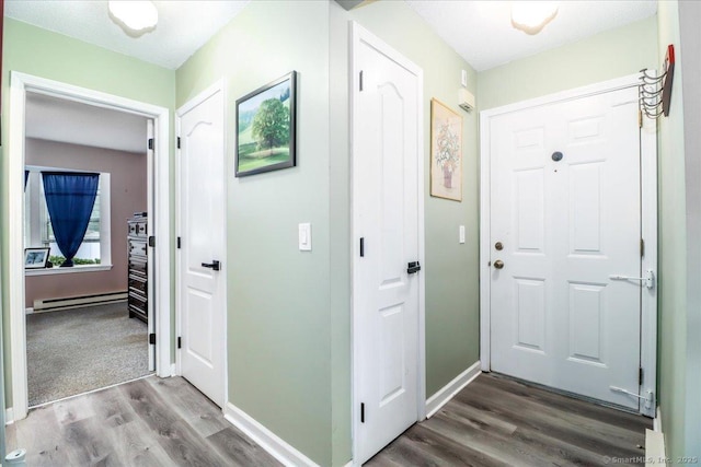 40 Glen Ridge Ct Unit 40, New Milford, CT 06776 - hall featuring a baseboard heating unit, wood finished floors, and baseboards