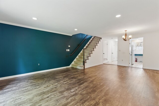 404 Cedar Hollow Dr Unit 404, Rocky Hill, CT 06067 - unfurnished living room with a chandelier, wood finished floors, baseboards, stairs, and ornamental molding