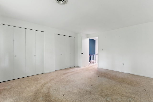 404 Cedar Hollow Dr Unit 404, Rocky Hill, CT 06067 - unfurnished bedroom featuring two closets and carpet flooring