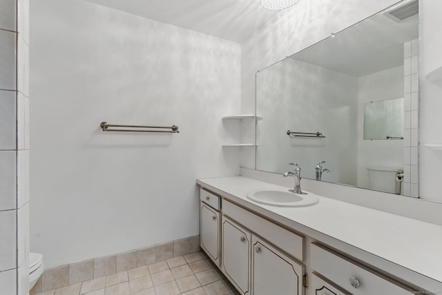 404 Cedar Hollow Dr Unit 404, Rocky Hill, CT 06067 - bathroom featuring toilet, vanity, and tile patterned floors