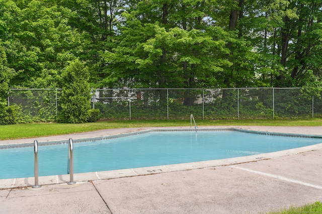 404 Cedar Hollow Dr Unit 404, Rocky Hill, CT 06067 - view of swimming pool featuring fence and view of wooded area