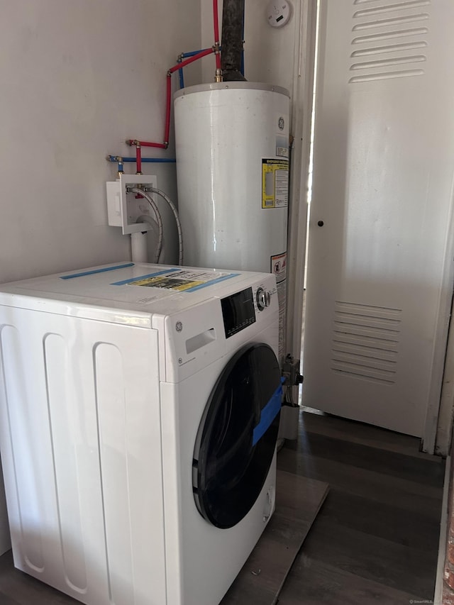 washroom with washer / clothes dryer, gas water heater, and wood finished floors