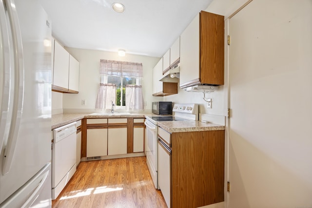 21 Cannon Ridge Dr Unit 21, Watertown, CT 06795 - kitchen with white appliances, a sink, light wood-type flooring, light countertops, and recessed lighting