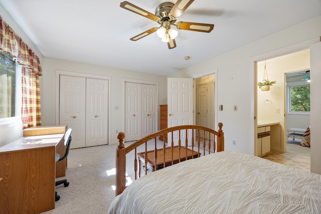 21 Cannon Ridge Dr Unit 21, Watertown, CT 06795 - bedroom with two closets, light carpet, ensuite bathroom, and ceiling fan