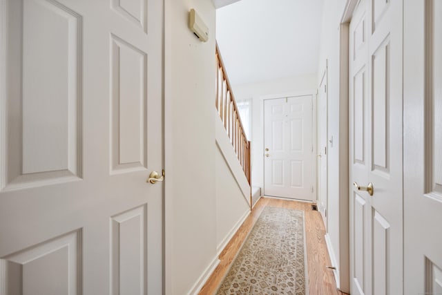 21 Cannon Ridge Dr Unit 21, Watertown, CT 06795 - hall with light wood-type flooring, stairway, and baseboards