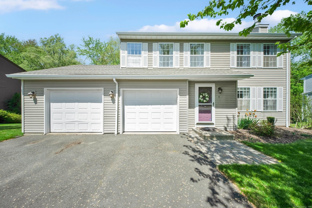 8 Douglas Way, Farmington, CT 06032 - view of front of home with asphalt driveway and a chimney