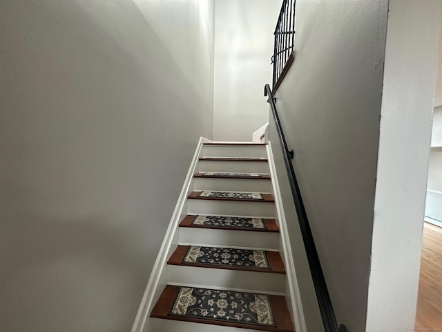 stairs with wood finished floors