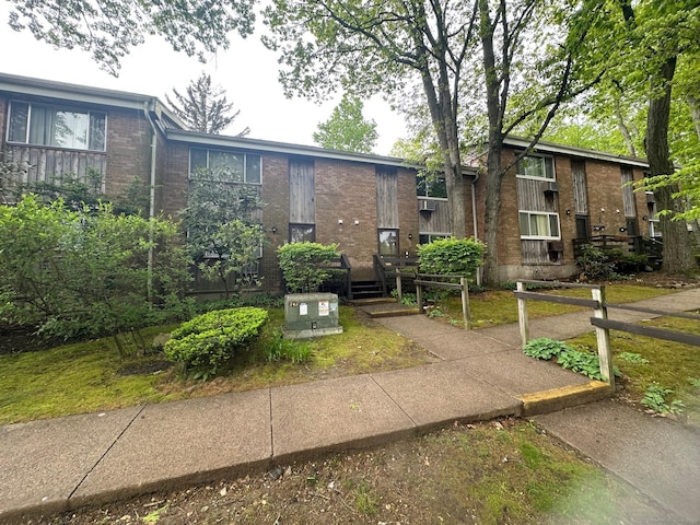 view of front of property with brick siding