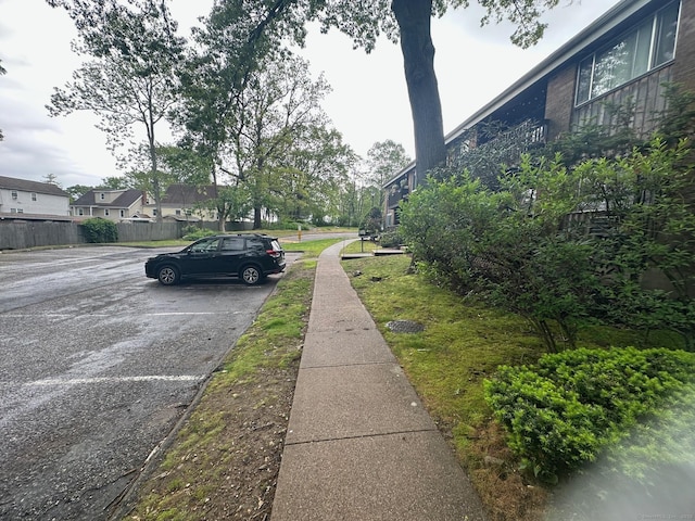 view of asphalt road featuring sidewalks