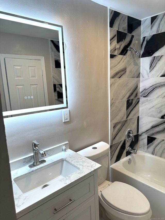 bathroom with toilet,  shower combination, and vanity