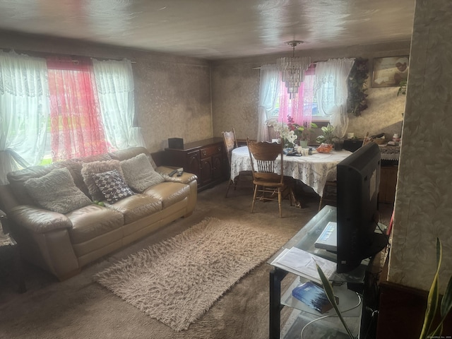57 Britt Rd, East Hartford, CT 06118 - carpeted living area featuring a chandelier